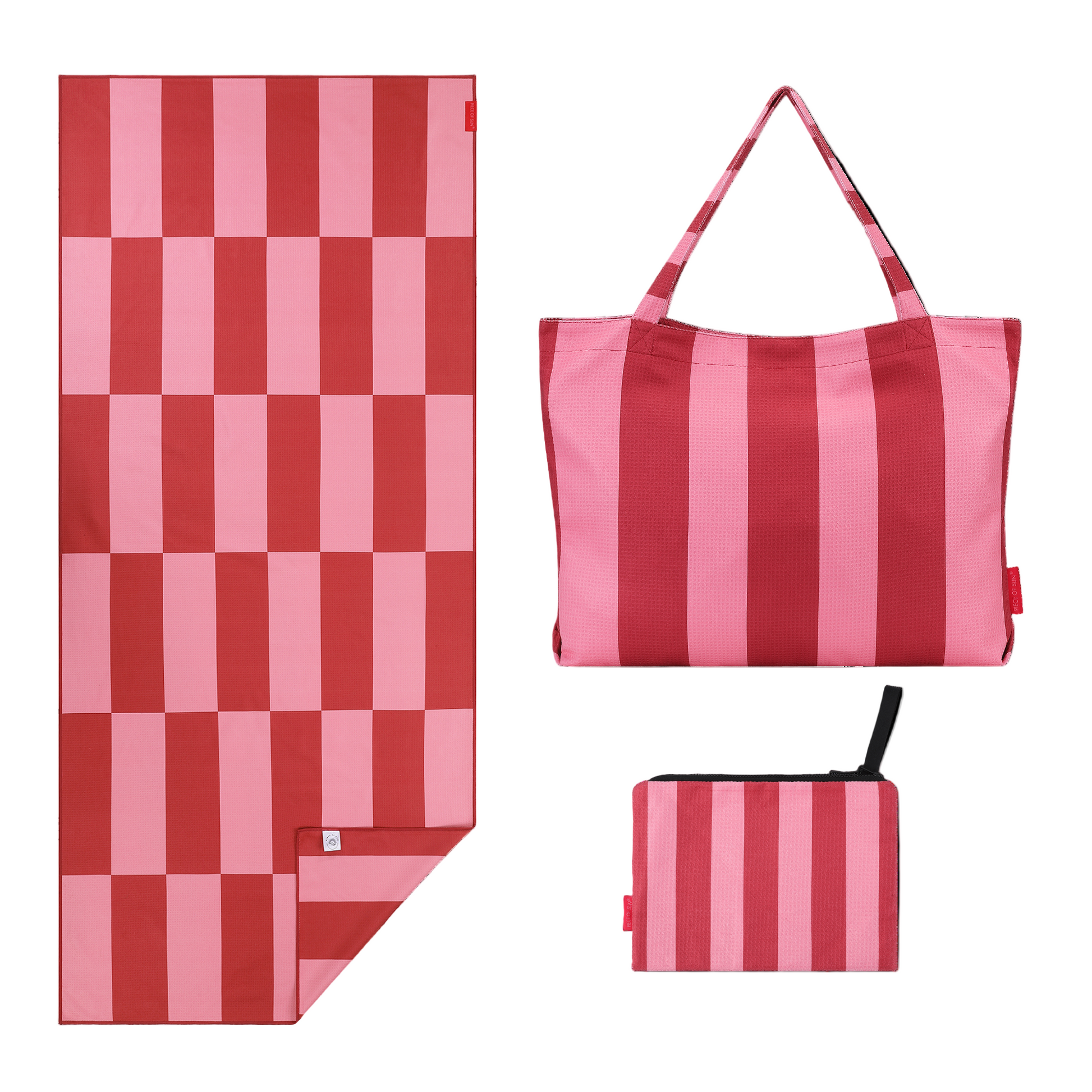 Roze strandset van Piece of Sun met handdoek, strandtas en pouch in bijpassende tinten.
